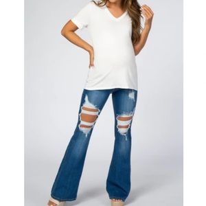 Distressed maternity bell bottoms with frayed hem